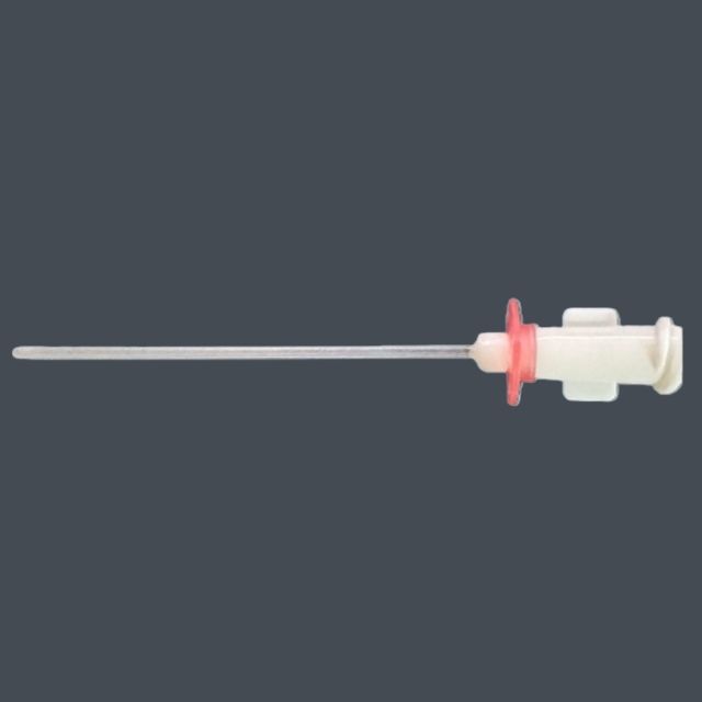 Long stainless steel needle connected to a white plastic handle with a red gasket, shown against a dark background.